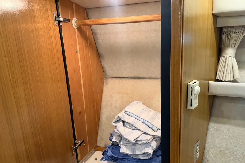 Slide: The Image of Wooden closet interior on a 2000 Bayliner 3988 Command Bridge Motoryacht. - 22