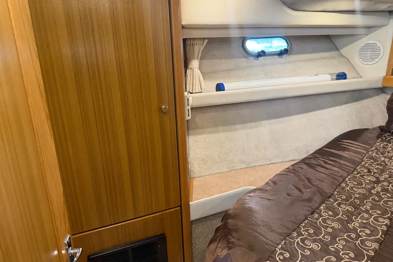 Slide: The Image of Interior cabin of 2000 Bayliner 3988 Command Bridge Motoryacht with wood paneling and cozy bed. - 21