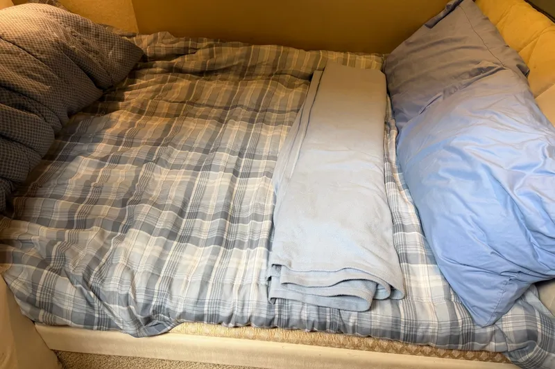 Slide: The Image of Cozy bed with plaid bedding in 2000 Bayliner 3988 Command Bridge Motoryacht cabin. - 30