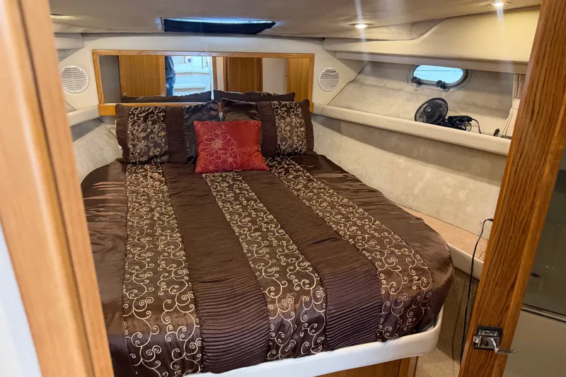 Slide: The Image of Luxurious bedroom interior of 2000 Bayliner 3988 Command Bridge Motoryacht with elegant bedding. - 20