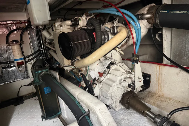 Slide: The Image of Engine room of a 2000 Bayliner 3988 Command Bridge Motoryacht, showcasing mechanical components. - 44