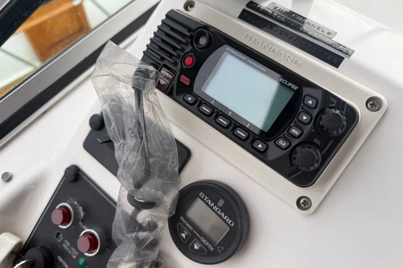 Slide: The Image of Control panel of a 2000 Bayliner 3988 Command Bridge Motoryacht with radio and depth gauge. - 39