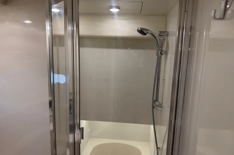 Slide: The Image of Shower area in 2000 Bayliner 3988 Command Bridge Motoryacht with glass door and chrome fixtures. - 26