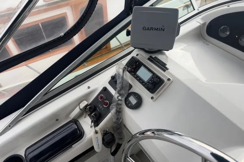 Slide: The Image of Control panel of 2000 Bayliner 3988 Command Bridge Motoryacht with Garmin navigation system. - 38