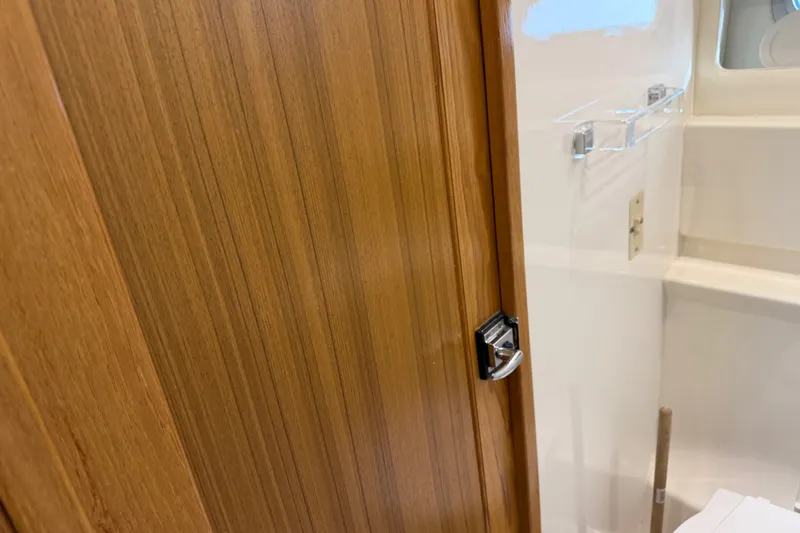 Slide: The Image of Wooden door and interior detail of a 2000 Bayliner 3988 Command Bridge Motoryacht. - 34