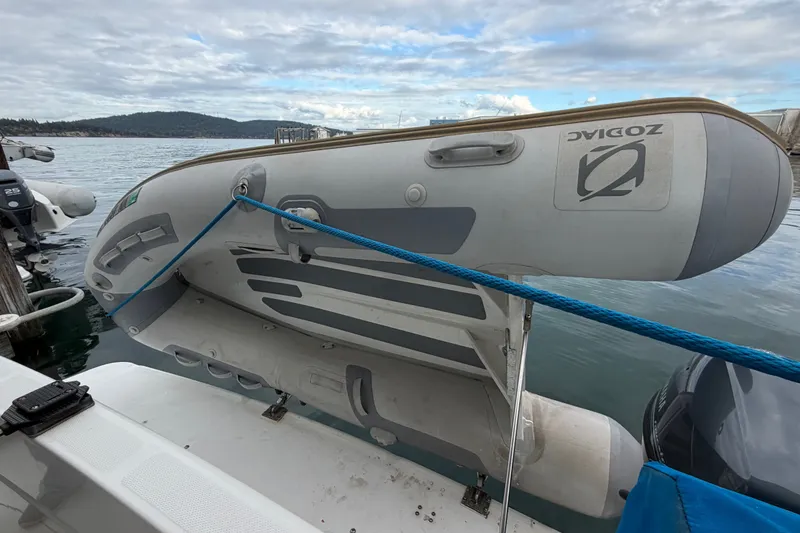 Slide: The Image of Inflatable Zodiac boat secured on a 2000 Bayliner 3988 Command Bridge Motoryacht. - 47