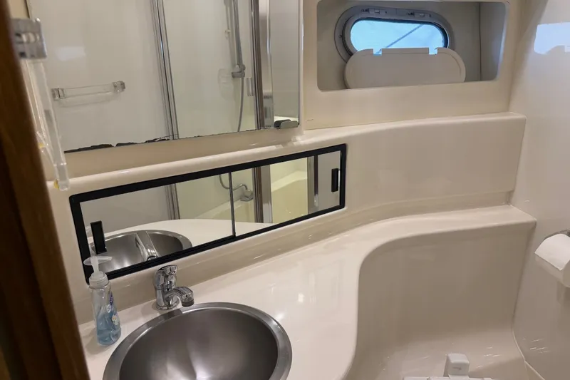 Slide: The Image of Bathroom interior of 2000 Bayliner 3988 Command Bridge Motoryacht with sink and mirror. - 27