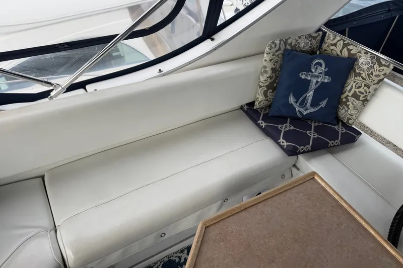 Slide: The Image of Cozy seating area on 2000 Bayliner 3988 Command Bridge Motoryacht with nautical-themed cushions. - 41