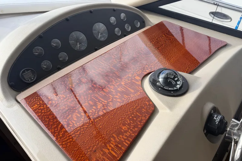 Slide: The Image of Dashboard of 2000 Bayliner 3988 Command Bridge Motoryacht with compass and gauges. - 13