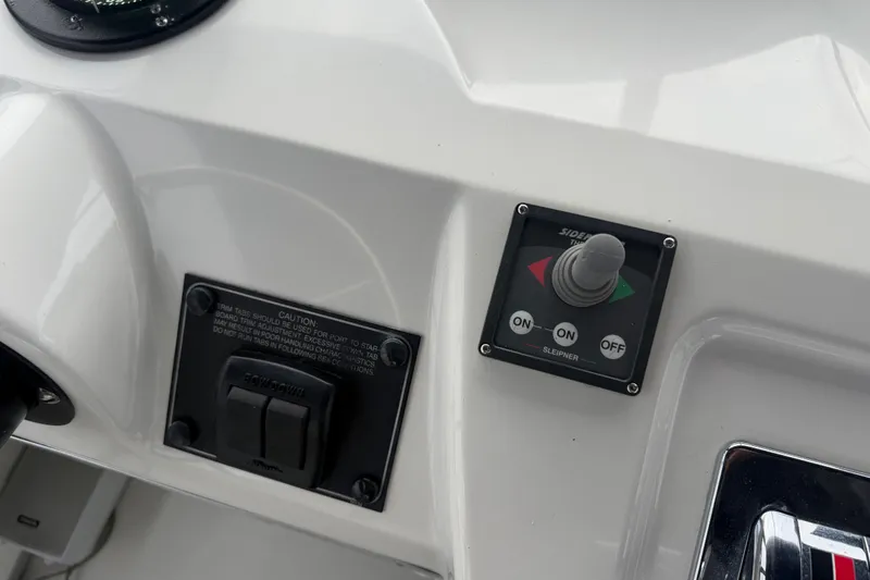 Slide: The Image of Control panel of a 2000 Bayliner 3988 Command Bridge Motoryacht with switches and joystick. - 37