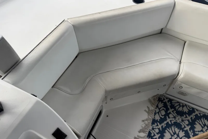 Slide: The Image of White seating area on 2000 Bayliner 3988 Command Bridge Motoryacht with patterned rug. - 40