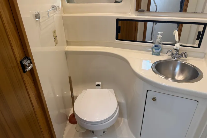 Slide: The Image of Bathroom interior of 2000 Bayliner 3988 Command Bridge Motoryacht with toilet and sink. - 31
