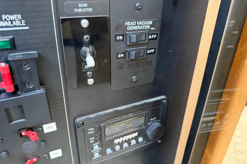 Slide: The Image of Control panel of a 2000 Bayliner 3988 Command Bridge Motoryacht with switches and display. - 50