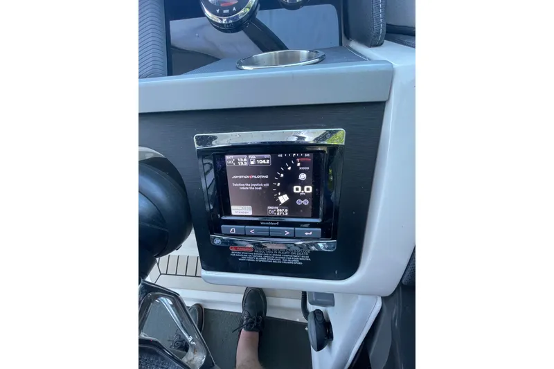 Slide: The Image of Control panel of a 2015 Sea Ray SLX 350 boat with joystick piloting display. - 17