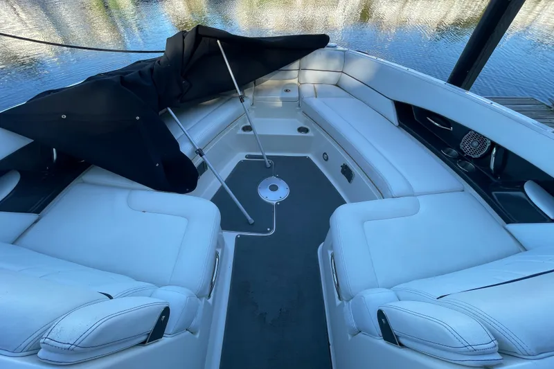 Slide: The Image of Luxurious 2015 Sea Ray SLX 350 boat interior with white seating and water view. - 13