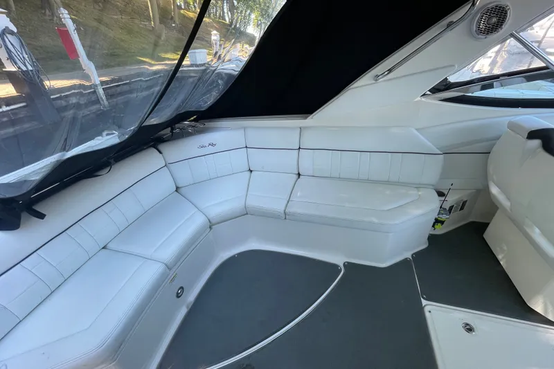 Slide: The Image of Luxurious interior of 2015 Sea Ray SLX 350 boat with white seating and sleek design. - 7