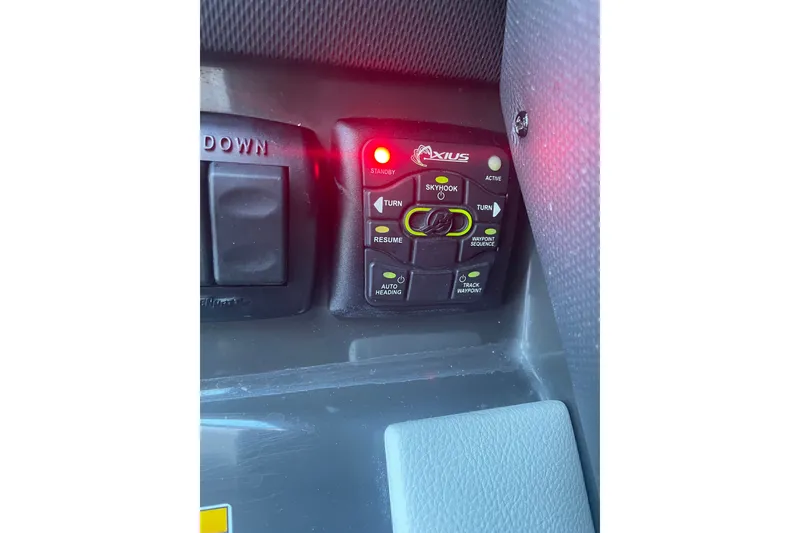 Slide: The Image of Control panel of a 2015 Sea Ray SLX 350 boat with Axius system. - 18