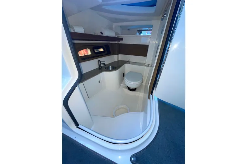 Slide: The Image of Interior of 2015 Sea Ray SLX 350 boat bathroom with sink and toilet. - 20