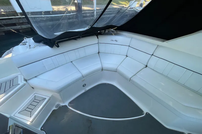 Slide: The Image of Luxurious white seating area on a 2015 Sea Ray SLX 350 boat. - 6