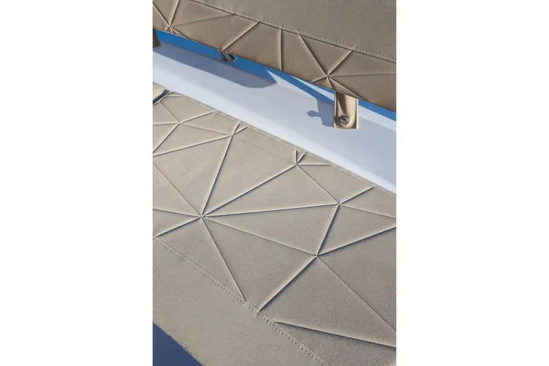 Slide: The Image of Beige geometric upholstery detail on 2027 Axopar 38 Cross Cabin boat seat. - 22