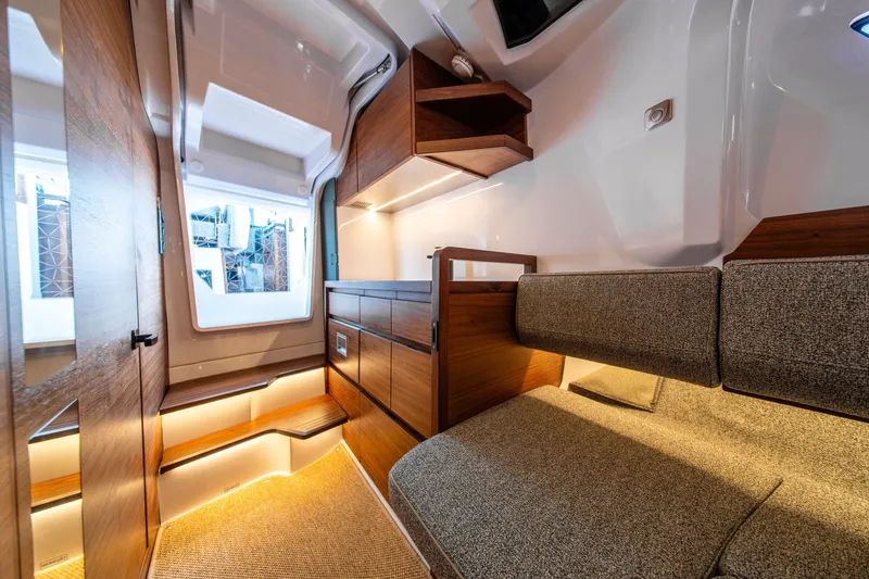 Slide: The Image of Luxurious interior of 2027 Axopar 38 Cross Cabin with modern wood finishes and cozy seating. - 33