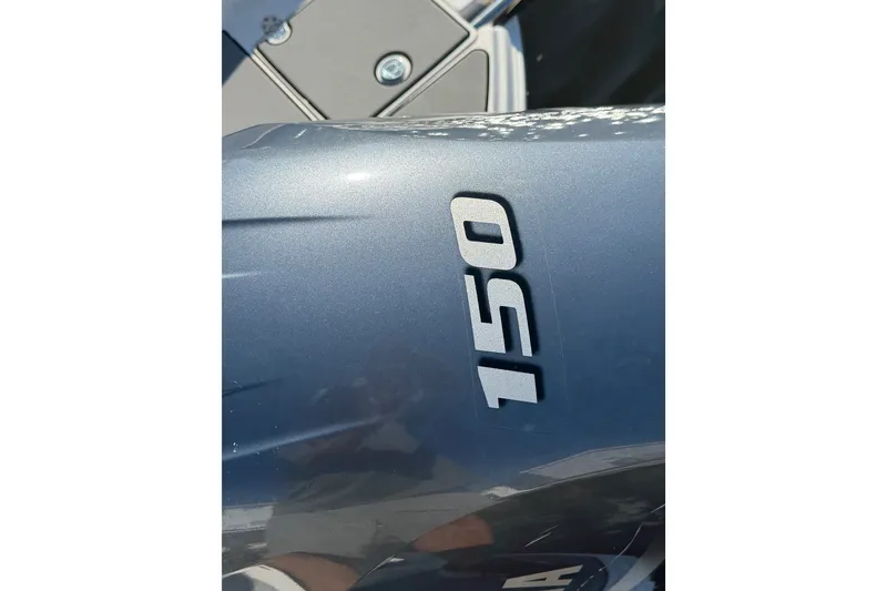 Slide: The Image of Close-up of 2021 NauticStar 223 DC boat engine with '150' marking. - 27