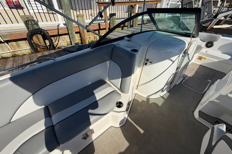 Slide: The Image of 2021 NauticStar 223 DC boat interior with gray seating and sleek design. - 16