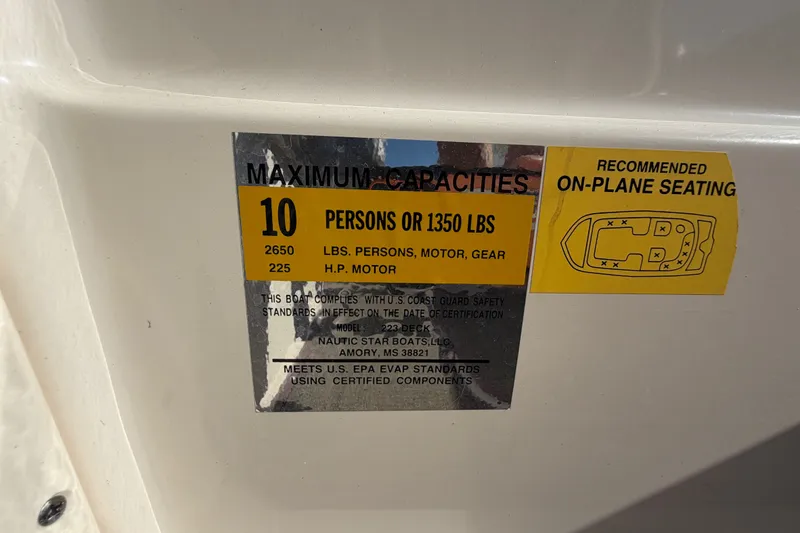 Slide: The Image of Maximum capacity label on 2021 NauticStar 223 DC boat, indicating 10 persons or 1350 lbs. - 25