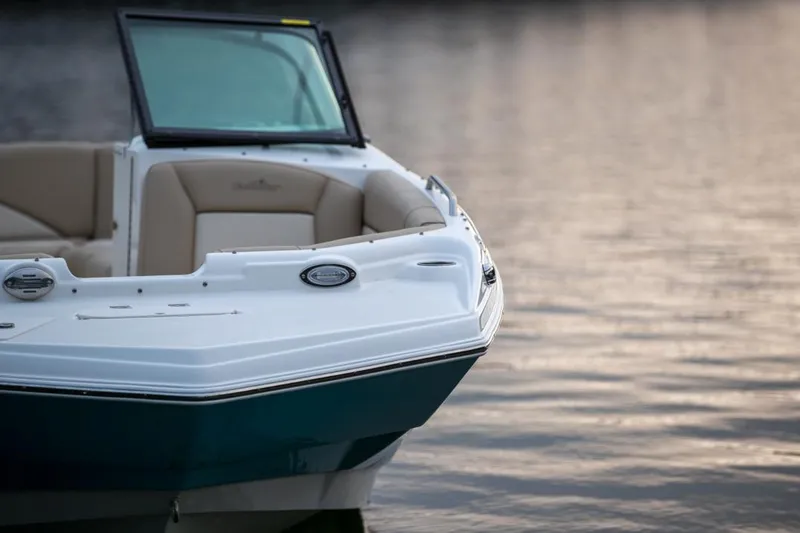 Slide: The Image of Manufacturer Provided Image: 2021 NauticStar 223 DC boat on calm water at sunset. - 1
