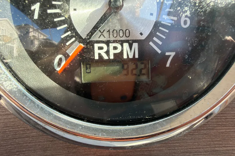 Slide: The Image of Close-up of a 2021 NauticStar 223 DC tachometer showing RPM gauge reading. - 26