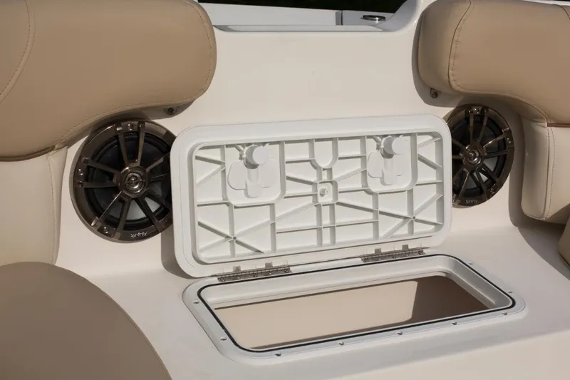 Slide: The Image of Manufacturer Provided Image: Open storage compartment on a 2021 NauticStar 223 DC boat with beige seating. - 4