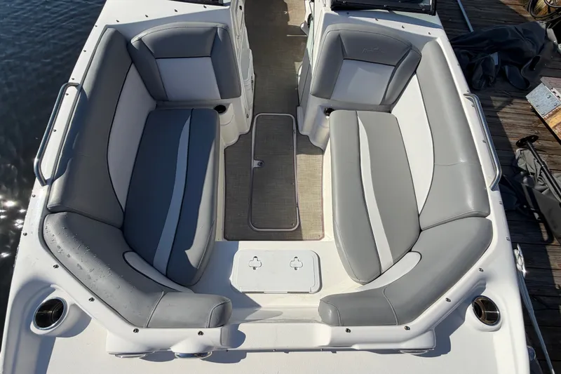 Slide: The Image of 2021 NauticStar 223 DC boat interior with gray seating and spacious layout. - 21