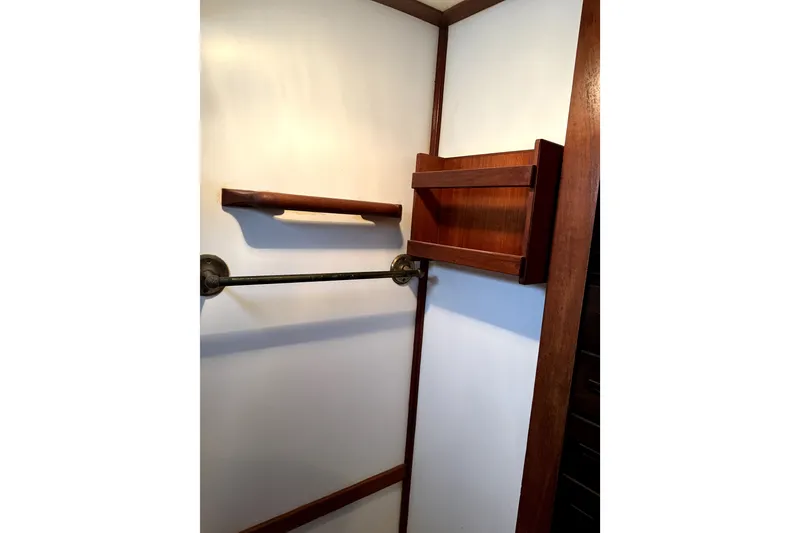 Slide: The Image of Wooden interior of 1979 Tayana 37 sailboat with shelves and handrails. - 18