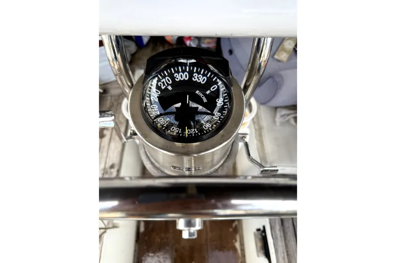 Slide: The Image of Compass on 1979 Tayana 37 sailboat, showing navigation directions. - 25