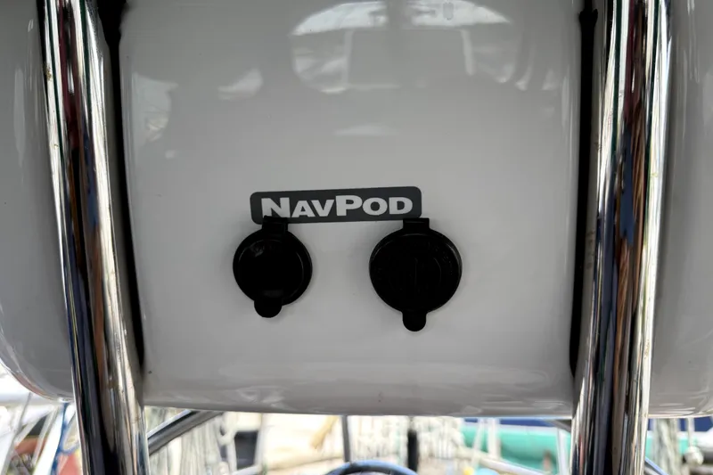 Slide: The Image of NavPod installation on 1979 Tayana 37 sailboat, featuring dual outlets and chrome supports. - 26