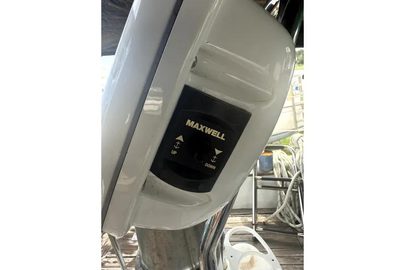 Slide: The Image of Maxwell windlass control on 1979 Tayana 37 sailboat, featuring up and down buttons. - 28