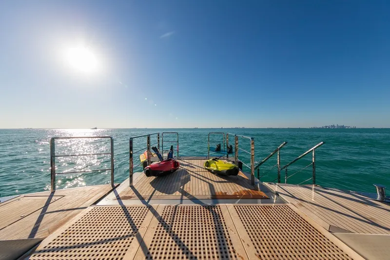 Slide: The Image of Luxurious Rossinavi Vector 50m yacht deck with sea view, featuring water sports equipment. - 39