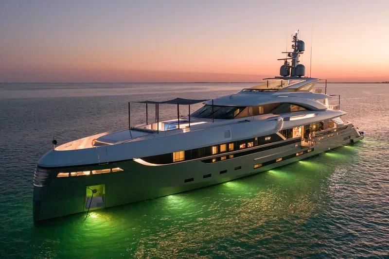 Slide: The Image of Luxurious Rossinavi Vector 50m yacht at sunset, 2020 model, illuminated on serene waters. - 33