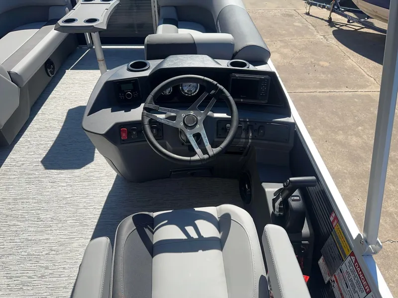 Slide: The Image of The image shows the cockpit of a 2027 Bennington 22 SSR with a modern steering wheel and instruments. - 5