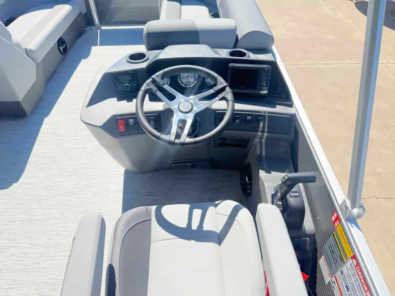 Slide: The Image of The image shows the helm of a 2027 Bennington 22 SFC with a modern steering wheel and display. - 5