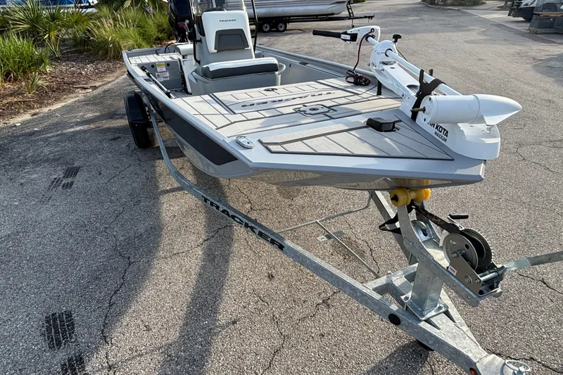 The Image of 2027 Tracker Bass Tracker Classic CC boat on trailer, parked outdoors. - 0