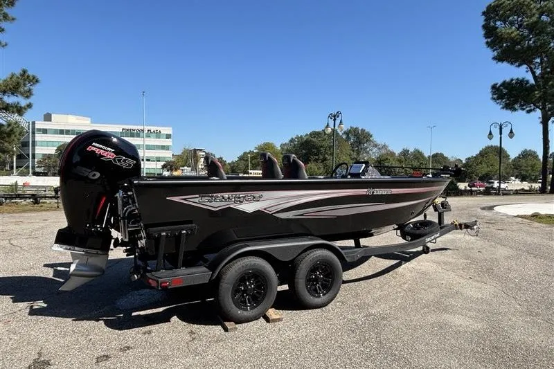Slide: The Image of 2026 Ranger VS1882SC Angler boat on trailer, parked outdoors under clear blue sky. - 10