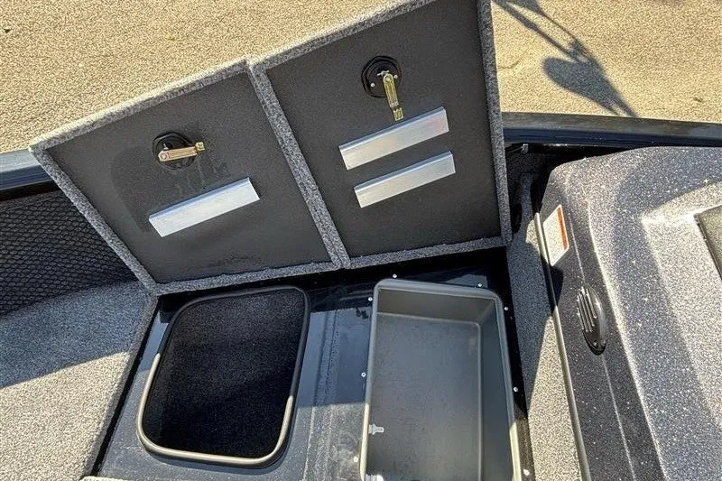 Slide: The Image of The image shows the storage compartment of a 2026 Ranger VS1882SC Angler boat. - 21