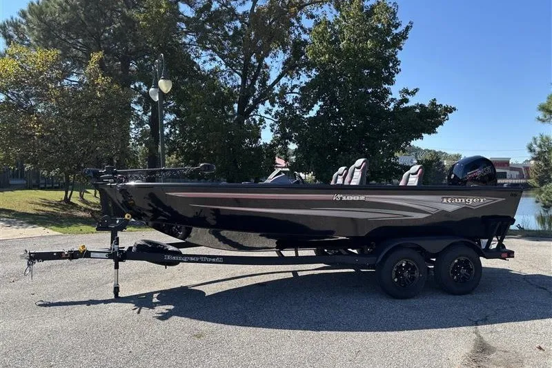 Slide: The Image of 2026 Ranger VS1882SC Angler boat on trailer, parked outdoors. - 2