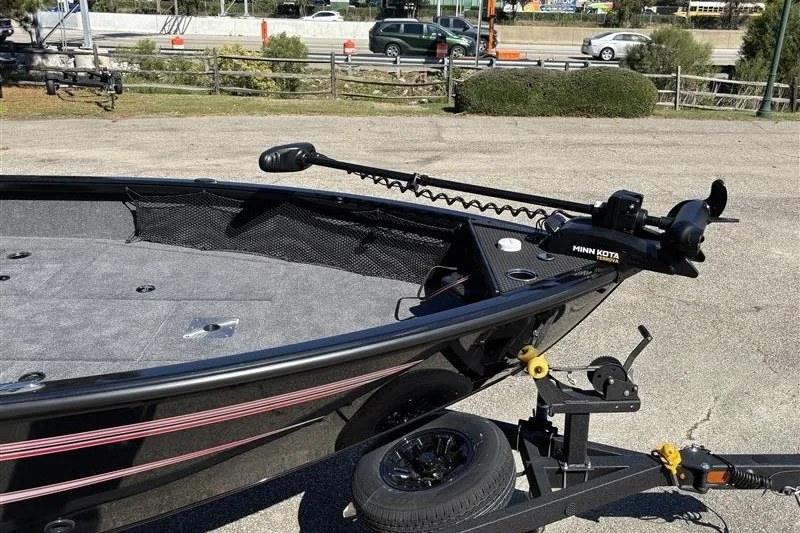 Slide: The Image of 2026 Ranger VS1882SC Angler boat on trailer, featuring Minn Kota trolling motor. - 13