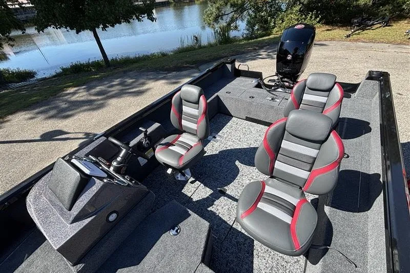 Slide: The Image of 2026 Ranger VS1882SC Angler boat interior with stylish seating and modern controls by a lake. - 25