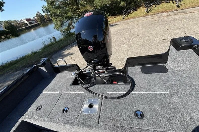 Slide: The Image of 2026 Ranger VS1882SC Angler boat with motor, parked near a scenic lake. - 33