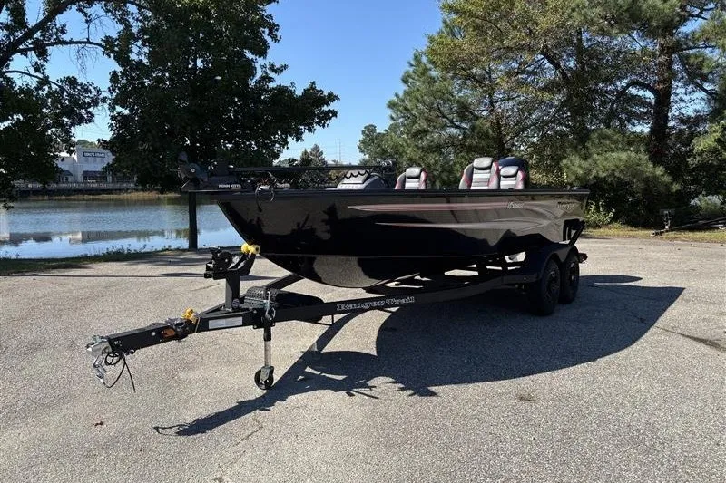 Slide: The Image of 2026 Ranger VS1882SC Angler boat on trailer, parked near a scenic lake. - 3
