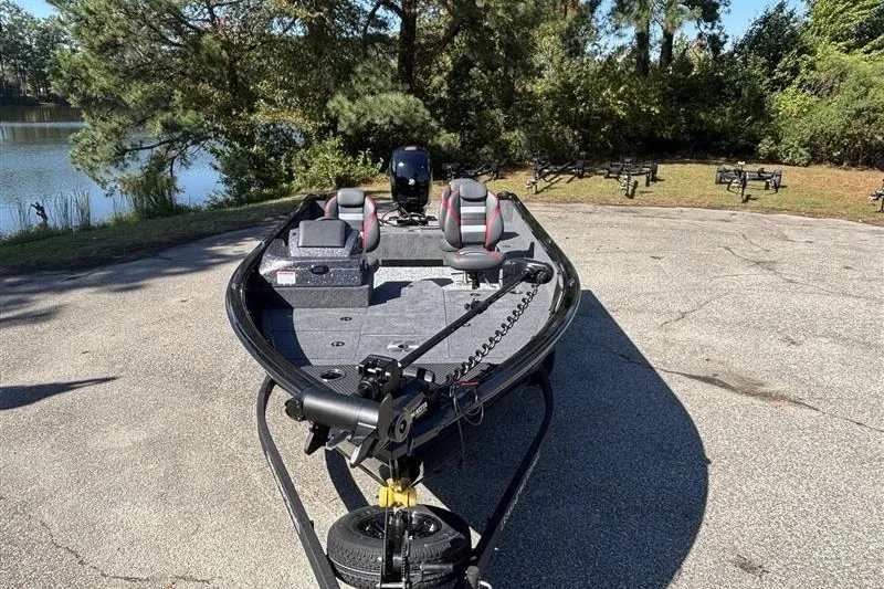 Slide: The Image of 2026 Ranger VS1882SC Angler boat parked near a scenic lake. - 4