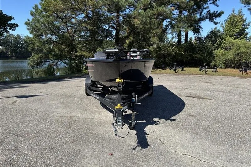 Slide: The Image of 2026 Ranger VS1882SC Angler boat on trailer, parked near a scenic lake. - 5